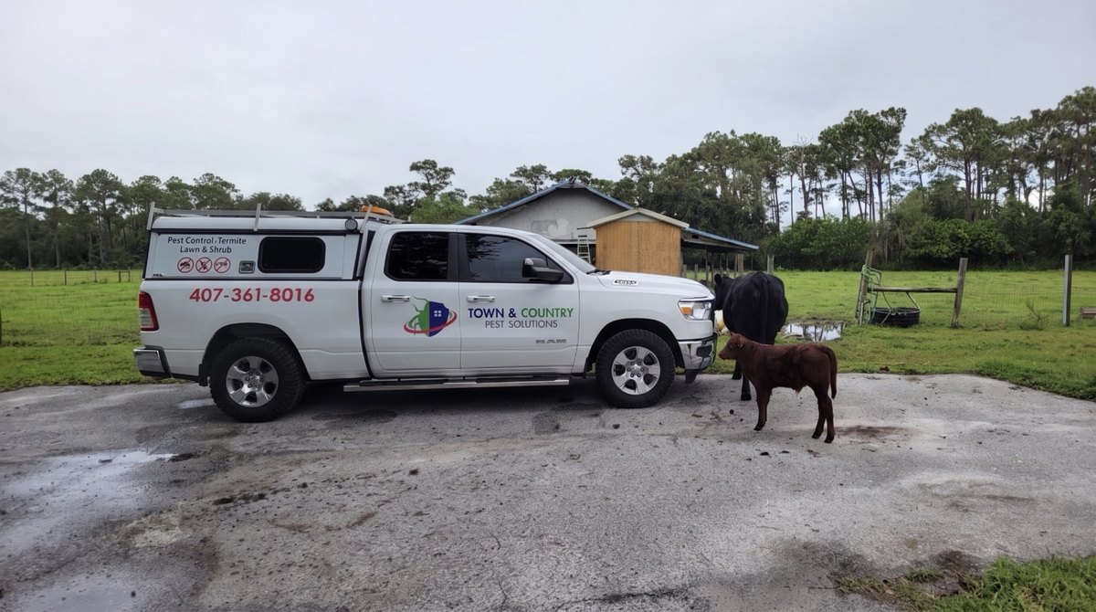 A Town and Country service truck parked on a rural Central Florida property
